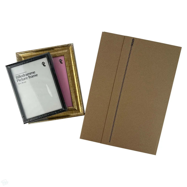 TPC-BW4 Book Wraps 310 x 250 x 0-70 mm - shown closed next to 2 picture frames, highlighting the fact that book wraps can be used for mailing more than just books.