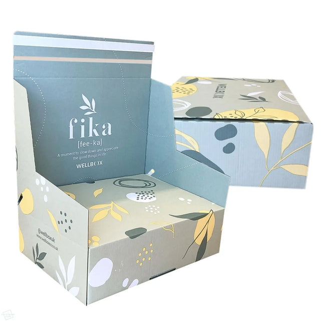 Branded cardboard boxes with crash lock bases, paper based frustration free opening and integrated sealing tape, with peel and seal closure. Featuring a floral design and 'fika' branding on a white background.