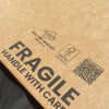 Fragile text printed onto a mailer designed to protect fragile vinyl records