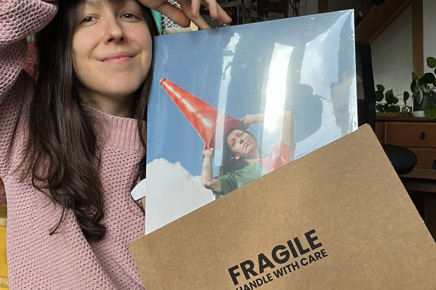 independent artist Natalie Holmes packing her vinyl record into our LP wallet vinyl mailer