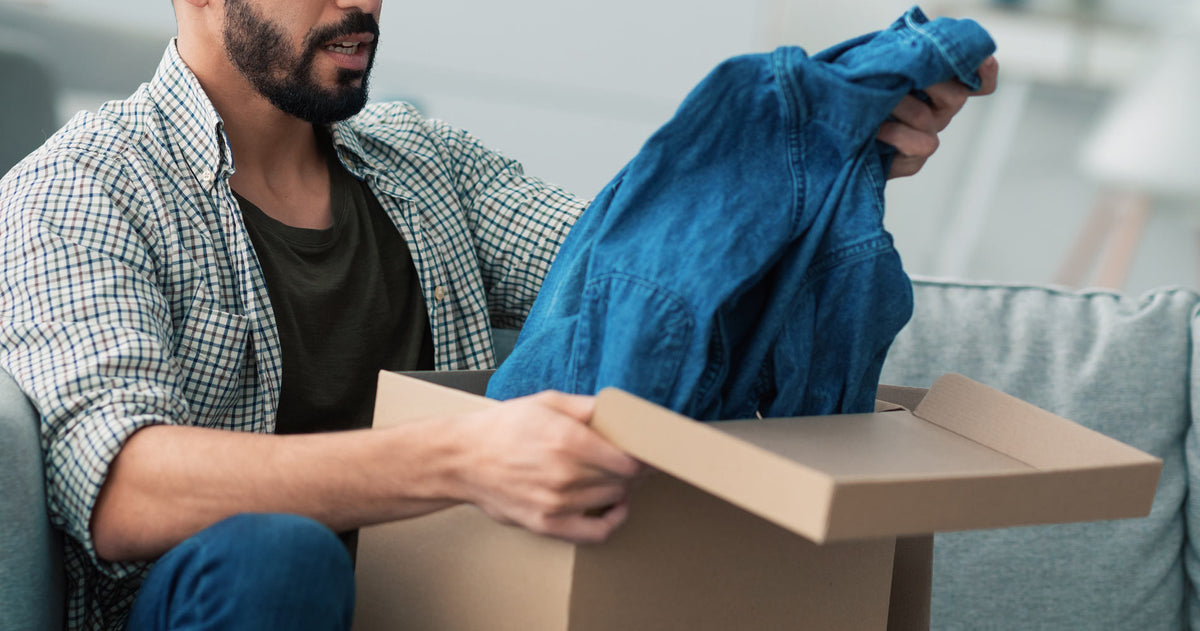 A man unboxing a product that was personally recommended and selected for him by AI - illustration how AI Powers CX in E-commerce Unboxing Personalisation