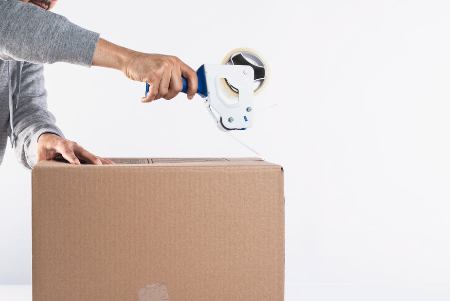 repurposing a cardboard box for storage