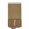 TPC-BW2 Book Wraps 248 x 165 x 0-70 mm - shot from above showing a hand holding the flaps down, inside the BW2 book wrap is a book about foraging for food with children, highlighting the fact this book wrap is ideal for shipping books