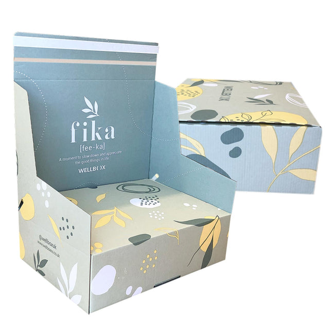 Branded cardboard boxes with crash lock bases, paper based frustration free opening and integrated sealing tape, with peel and seal closure. Featuring a floral design and 'fika' branding on a white background.