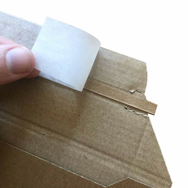 Heavy duty corrugated envelope with peel and seal strip