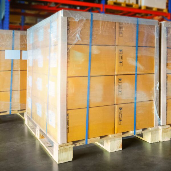 pallet edge protectors in use on a tall pallet wrapped with stretch film