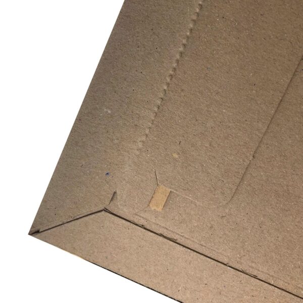 Plastic Free tear strip on our envelope - close up showing the perforations and edge of the paper strip